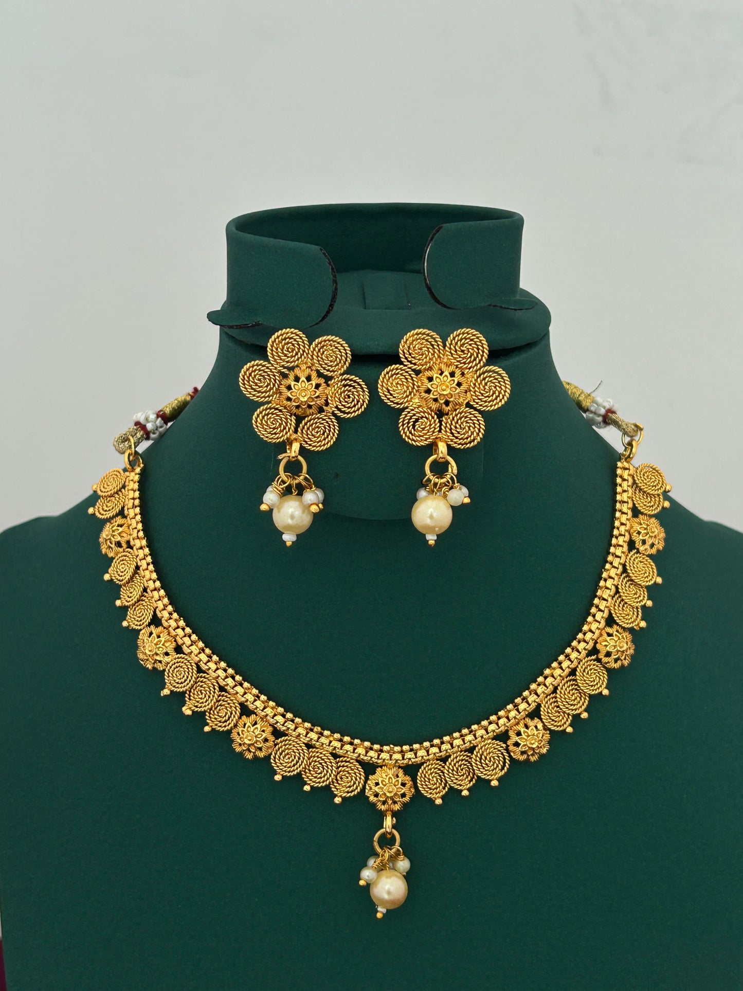 Antique Gold Spiral Floral Necklace Set with Pearl Drops Earrings for Festive Indian Wear