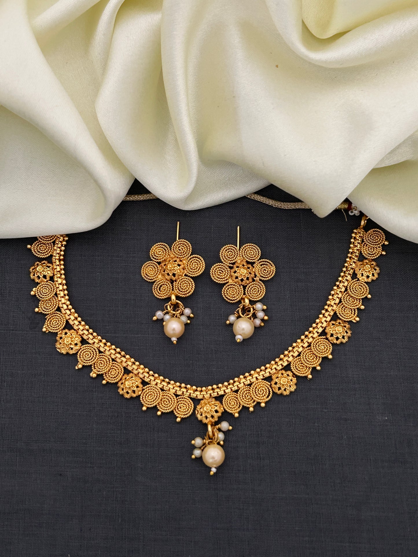 Antique Gold Spiral Floral Necklace Set with Pearl Drops Earrings for Festive Indian Wear
