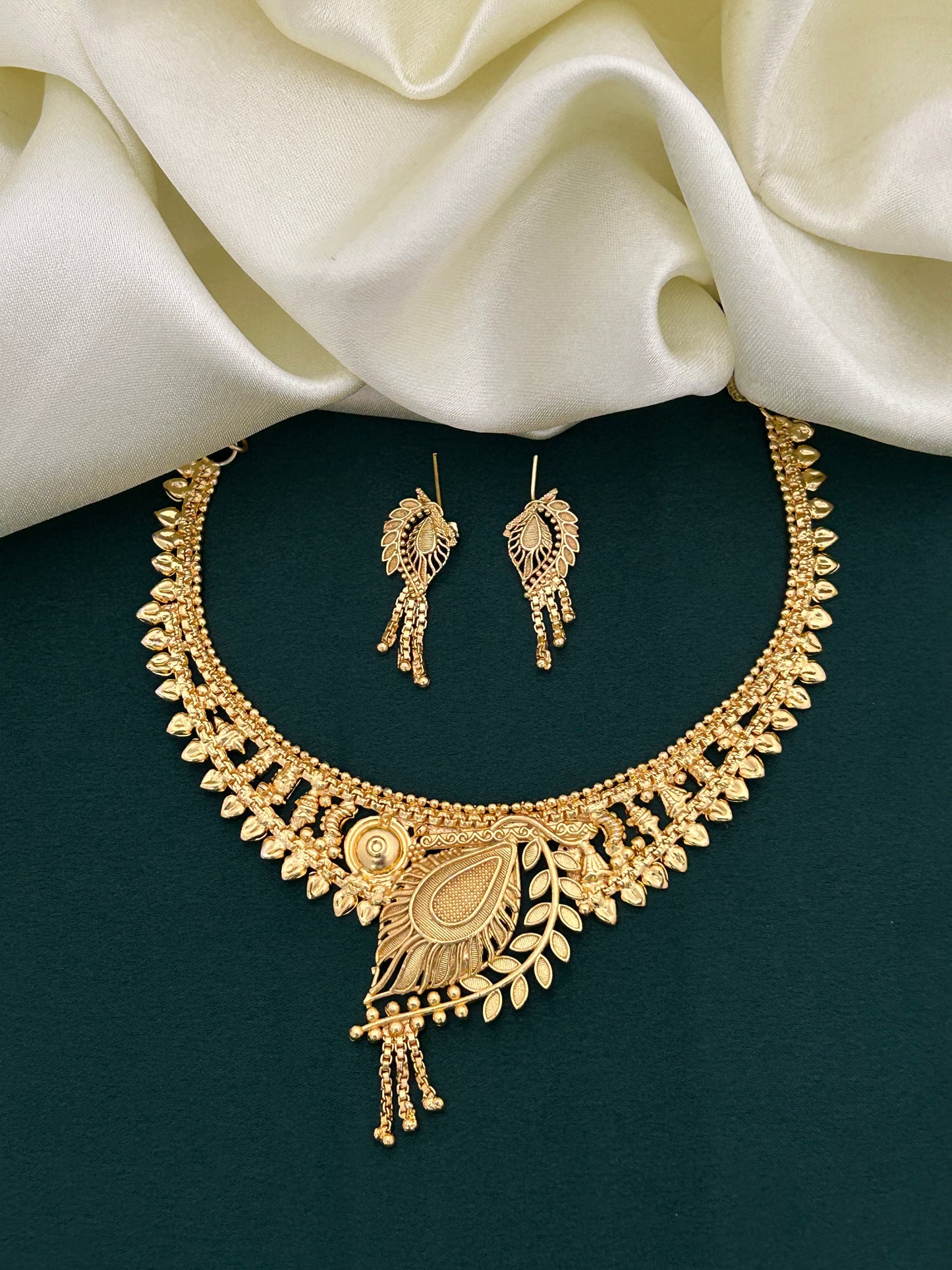 Paisley Motif Gold Plated Necklace Set with Leafy Accents and Festive Danglers