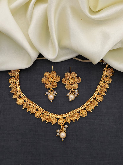 Antique Gold Spiral Floral Necklace Set with Pearl Drops Earrings for Festive Indian Wear