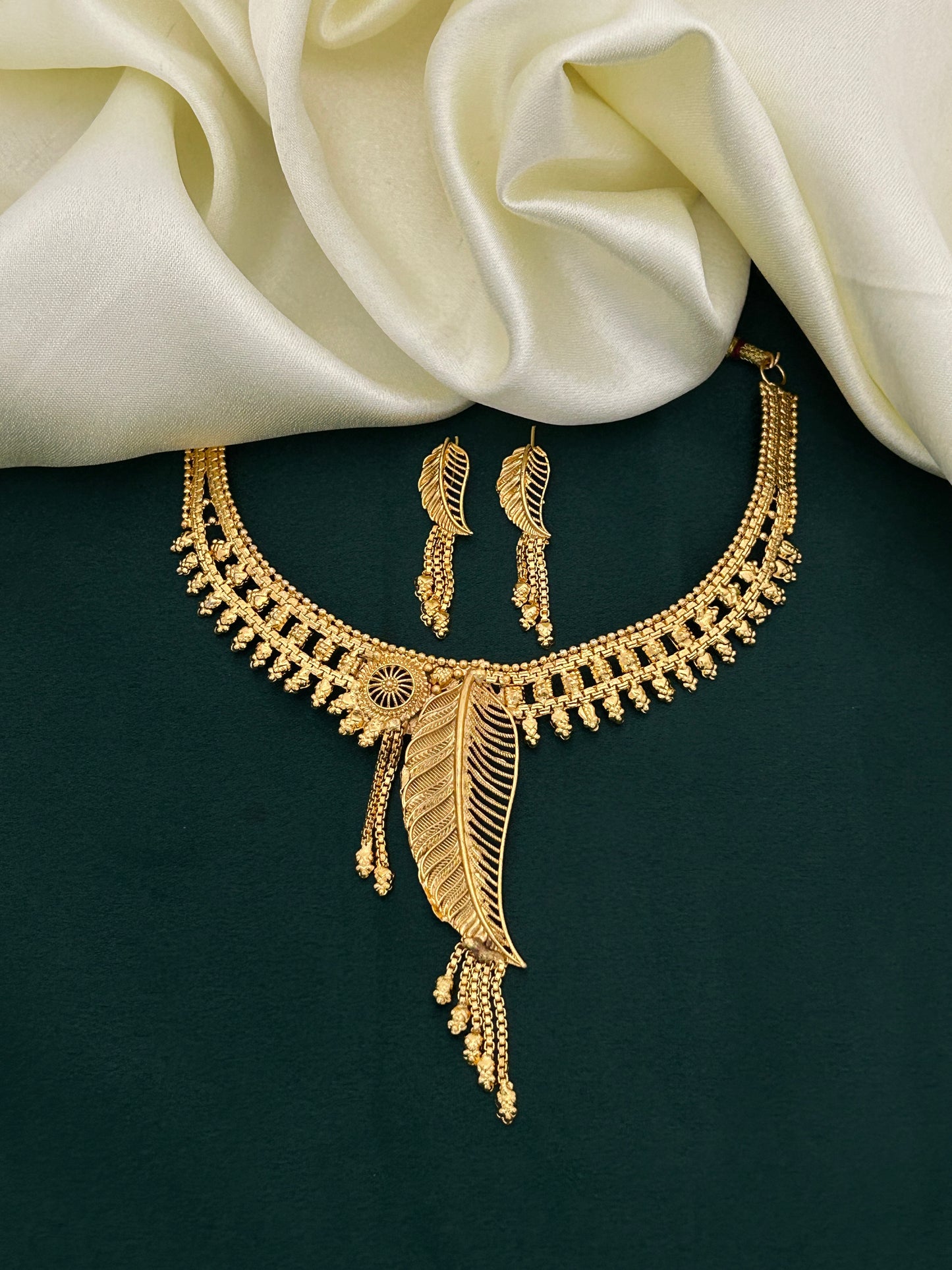 Gold Plated Leaf Motif Necklace Set with Delicate Dangling Beads for Ethnic Style